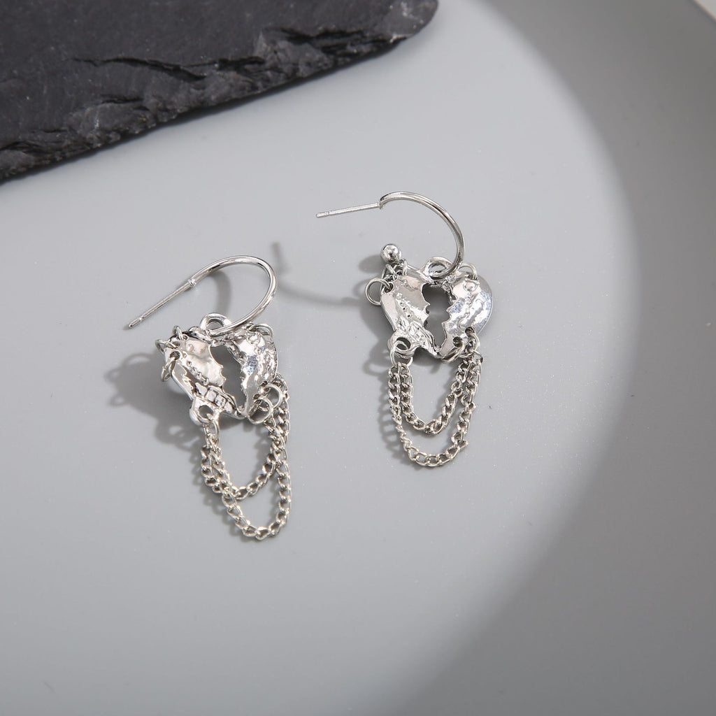 Damen Ohrringe mit funkelnden herzförmigen Anhängern und eleganten Kettendetails Shop Nory