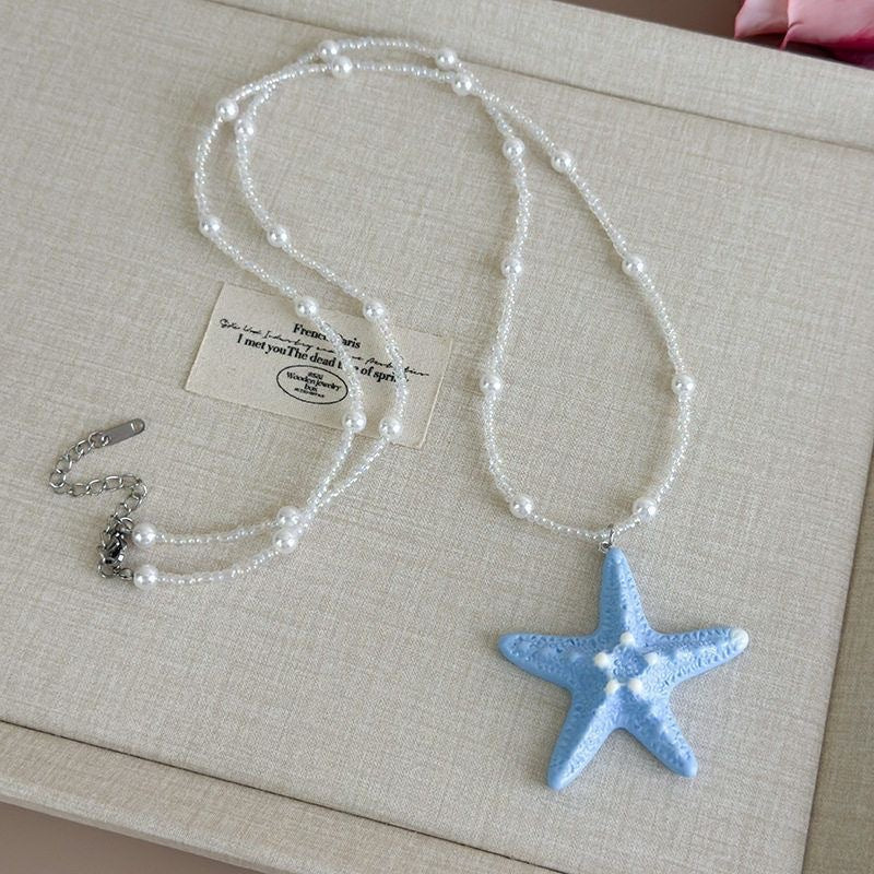 Damen Kette mit einzigartigem Sternenanhänger und buntem Perlenmuster Shop Nory
