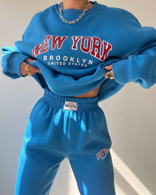 Damen Oversized Lounge-Set aus Baumwollfleece mit Collegestickerei und relaxed Jogginghose Shop Nory
