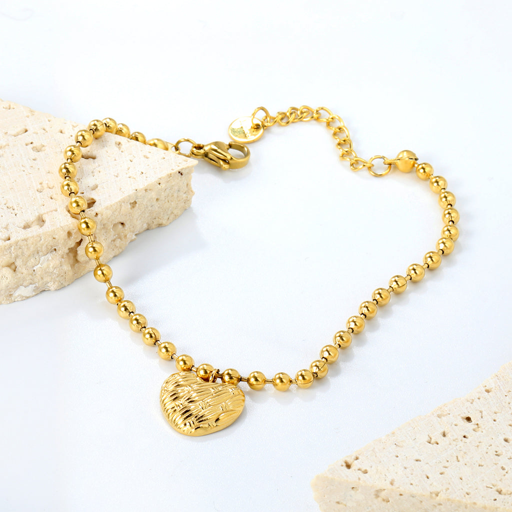 Damen Armband mit feinem Herzanhänger und eleganten Perlen Shop Nory