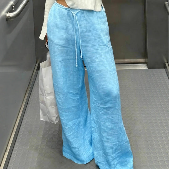 Damen Leinenhose mit lockerer, knöchellanger Passform, seitlichen Eingrifftaschen und Zierknopf-Details Shop Nory