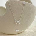 Damen Silberne Halskette mit stilvollem Schleifen-Design Shop Nory