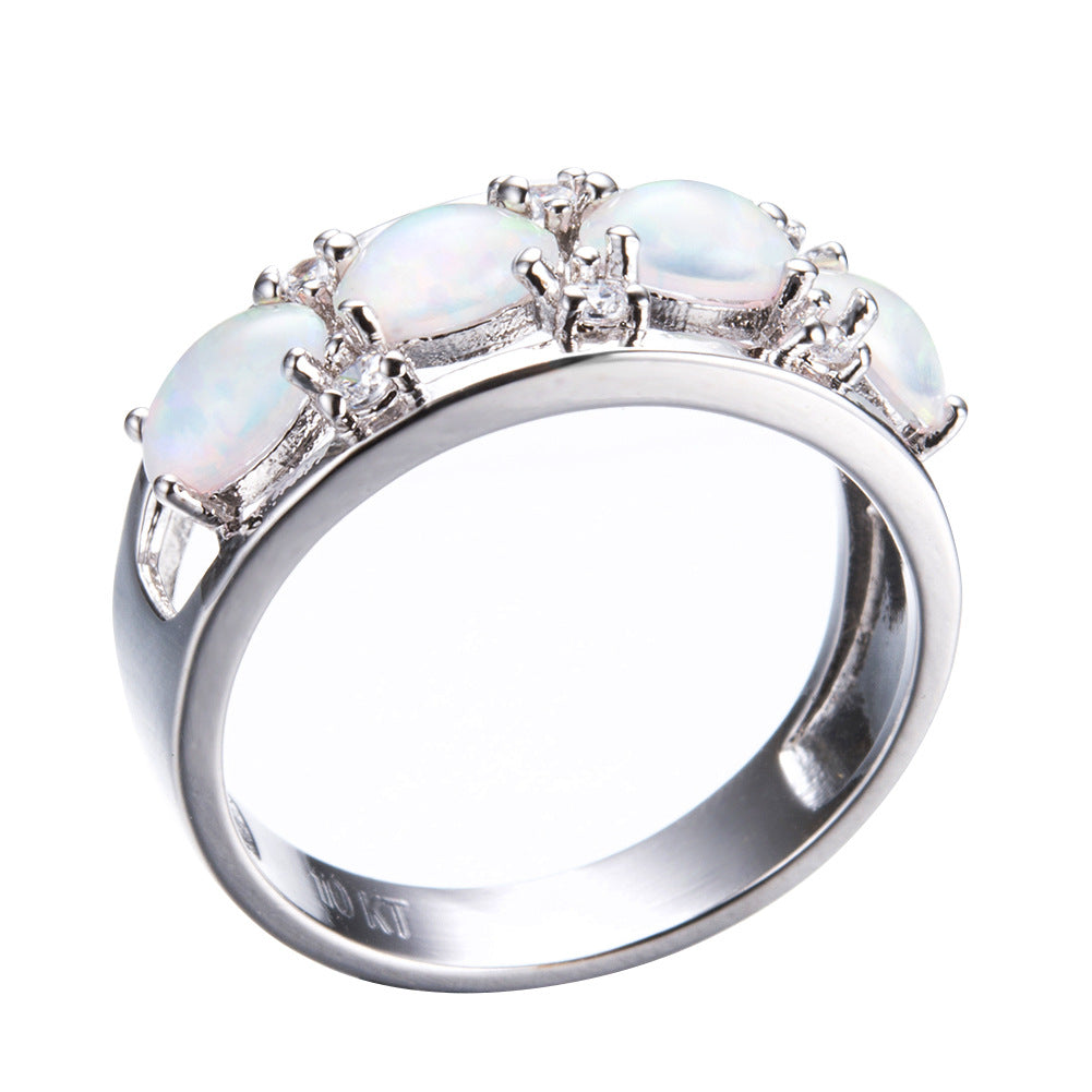 Damen Ring mit leuchtenden Opalsteinen und funkelnden Zirkonia-Elementen Shop Nory