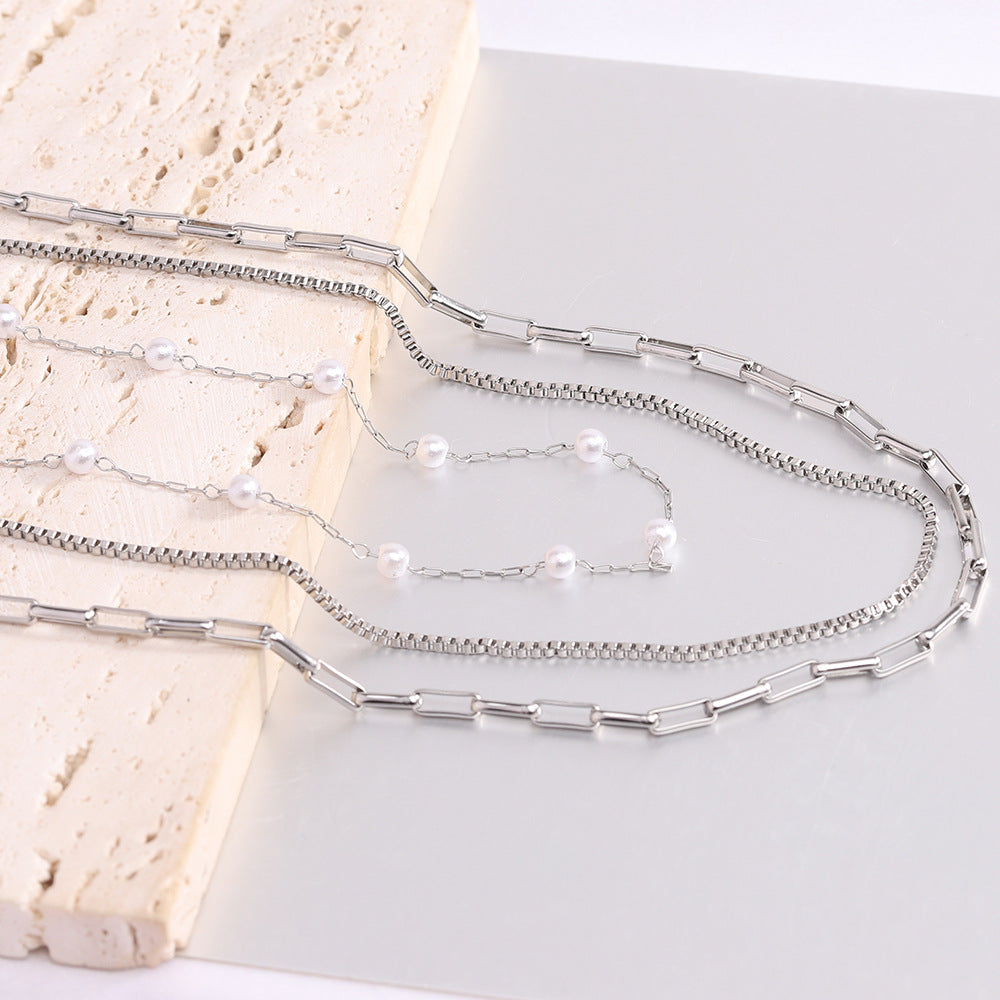 Damen Halskette mit modernen Gliederelementen und Perlenakzenten Shop Nory