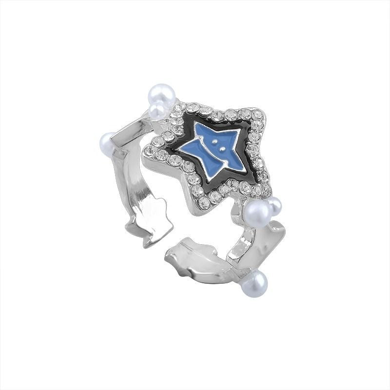 Damen Ring mit funkelndem Sternenanhänger und zarter Perlendekoration Shop Nory