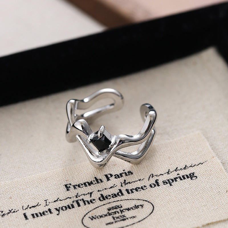 Damen Offener Ring mit künstlerisch geschwungenem Design und zentralem Stein Shop Nory