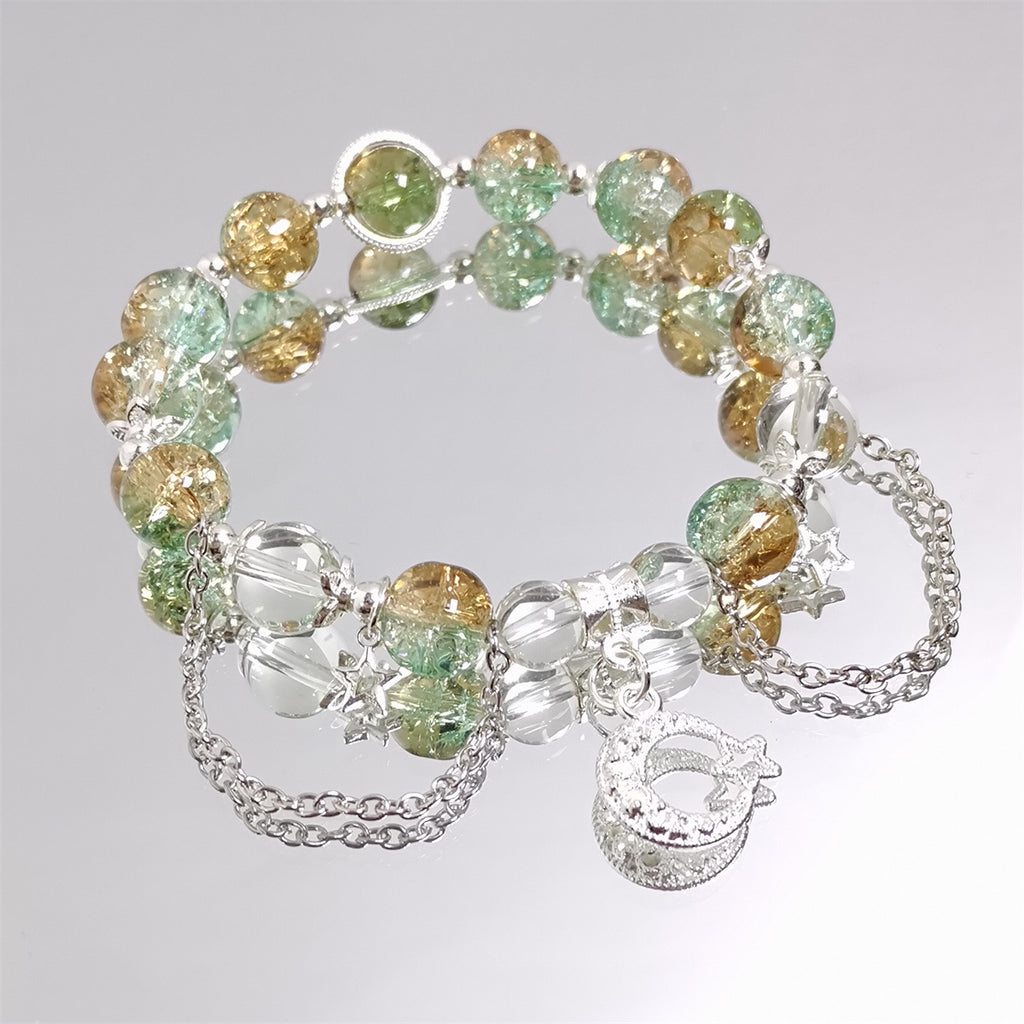 Damen Armband mit funkelnden Kristall-Elementen und charmanten Anhängern Shop Nory