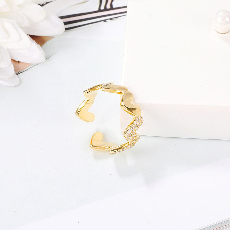 Damenring mit herzförmigem Design und funkelnden Zirkoniasteinen Shop Nory