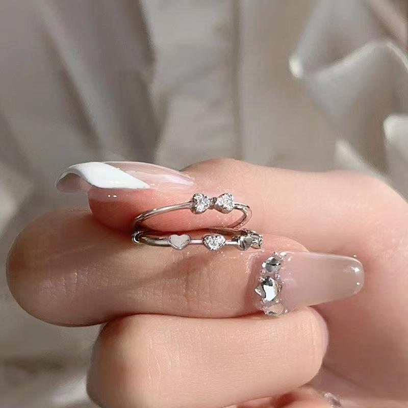 Damenring mit kunstvollem Doppel-Design und funkelnden Zirkonia Shop Nory