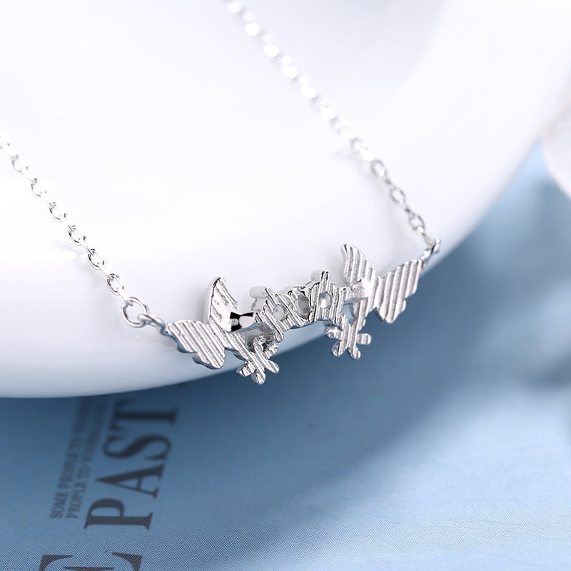 Damen Halskette mit filigranem Schmetterlingsdesign und funkelnden Zirkonia Shop Nory