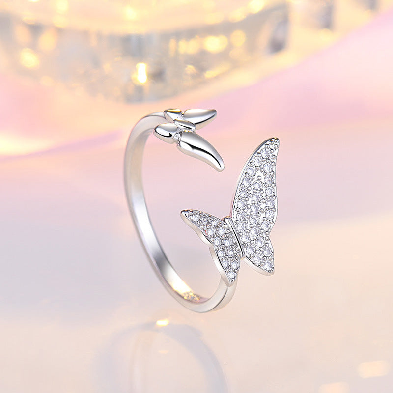 Damen Offener Ring mit filigranem Schmetterlingsdesign und funkelndem Zirkonia Shop Nory