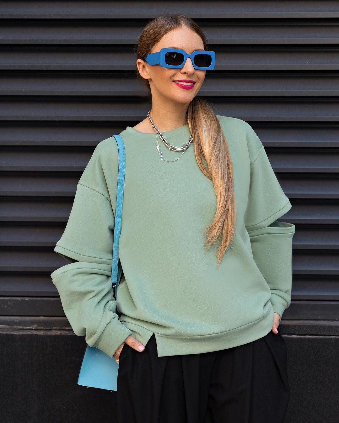 Damen Oversized Sweatshirt mit Layer-Ärmeln und seitlichem Schlitz Shop Nory