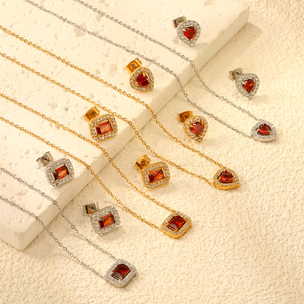 Damen Schmuckset mit funkelnden roten Zirkonia und elegantem Goldüberzug Shop Nory
