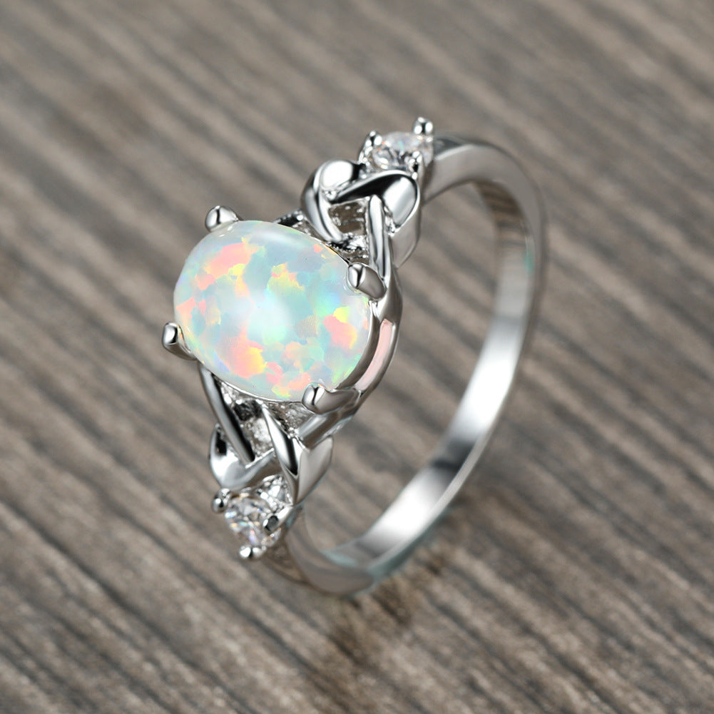 Damen Ring mit funkelndem Opalschmuck und kunstvollen Zirkonia-Details Shop Nory