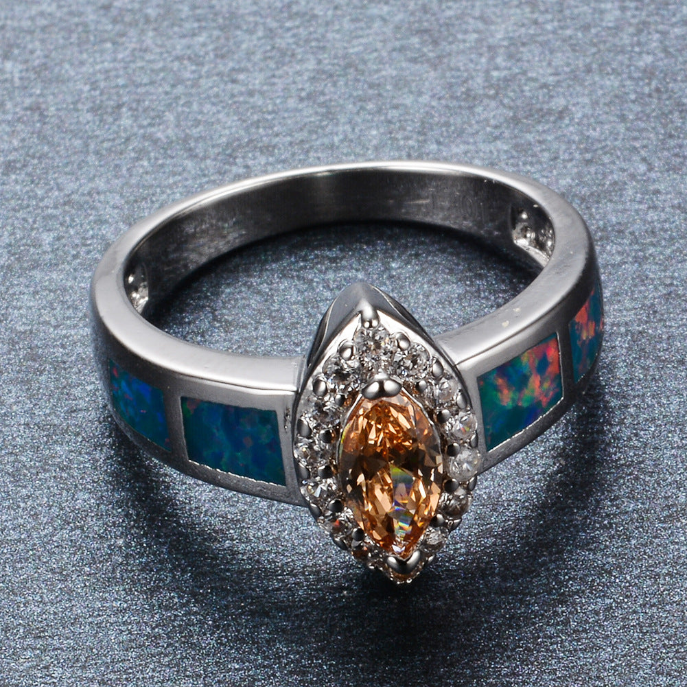 Damen Schmuckring mit funkelndem Zirkonia und schimmernden Opalmosaiken Shop Nory