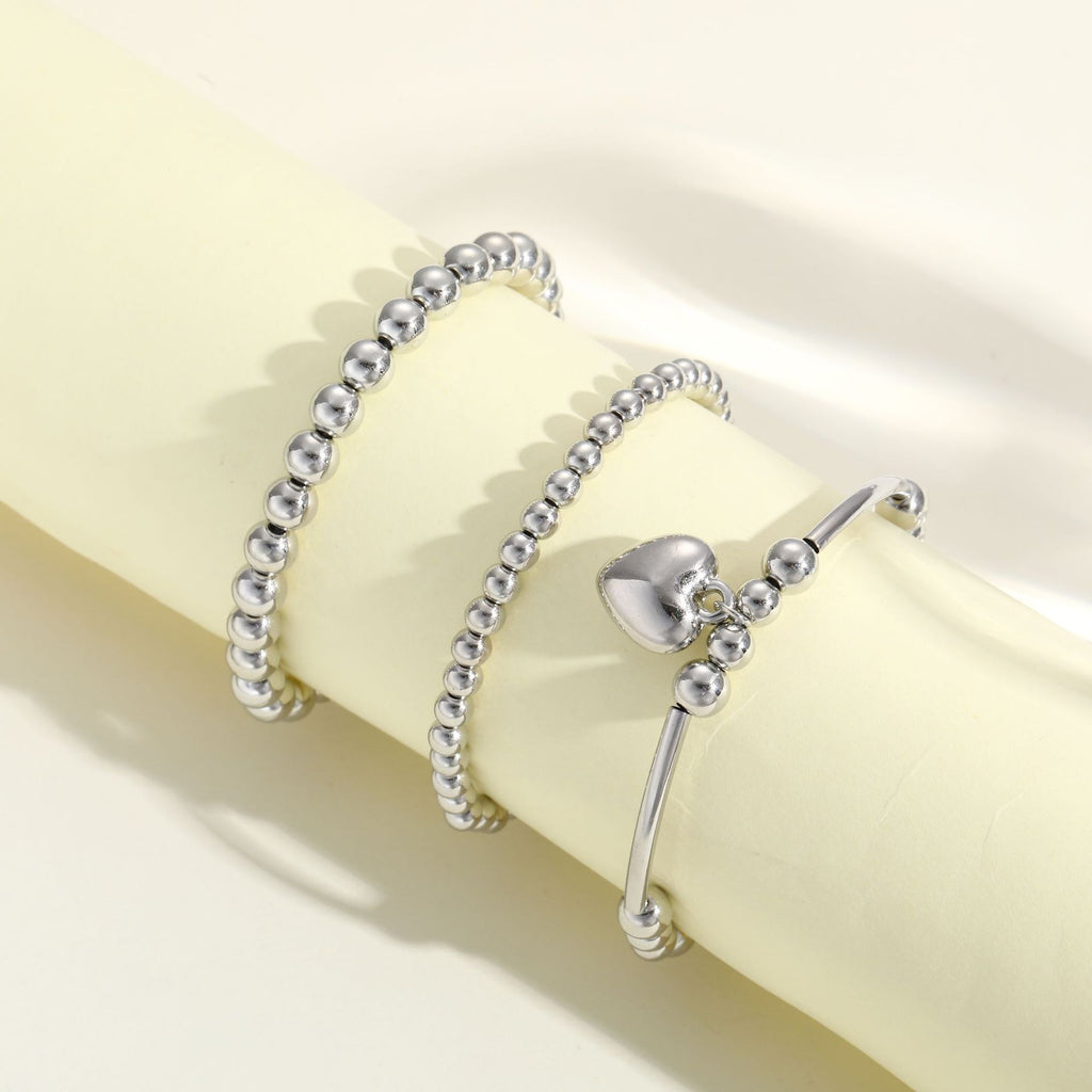 Damen Armband-Set mit funkelnden Perlen und eleganten Details Shop Nory