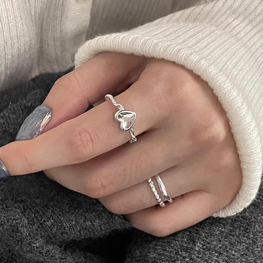 Damen herzförmiger Silberring mit elegantem Drehdesign Shop Nory