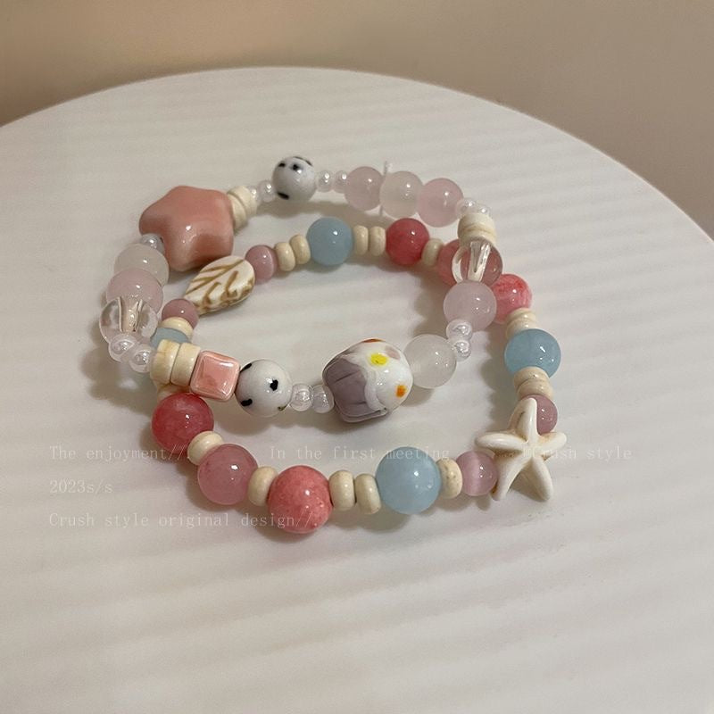 Damen Armband aus handgefertigten Natursteinen mit charmanten Tiermotiven Shop Nory