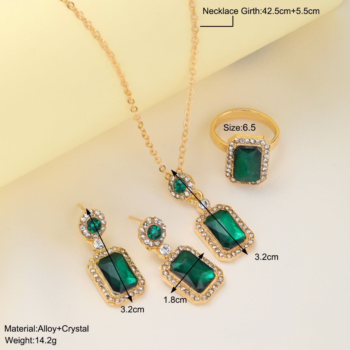 Damen Schmuckset mit funkelnden Smaragd und goldenen Akzenten Shop Nory