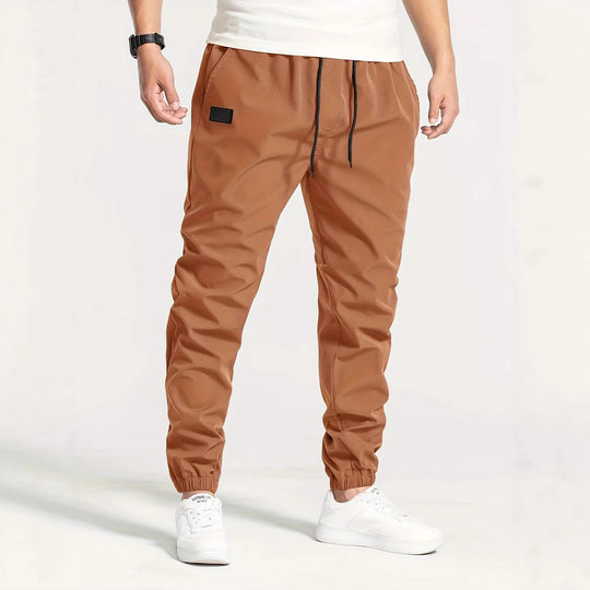 Herren Technische Jogginghose im Tapered‑Utility‑Stil mit elastischem Bund & Knöchelbündchen Shop Nory