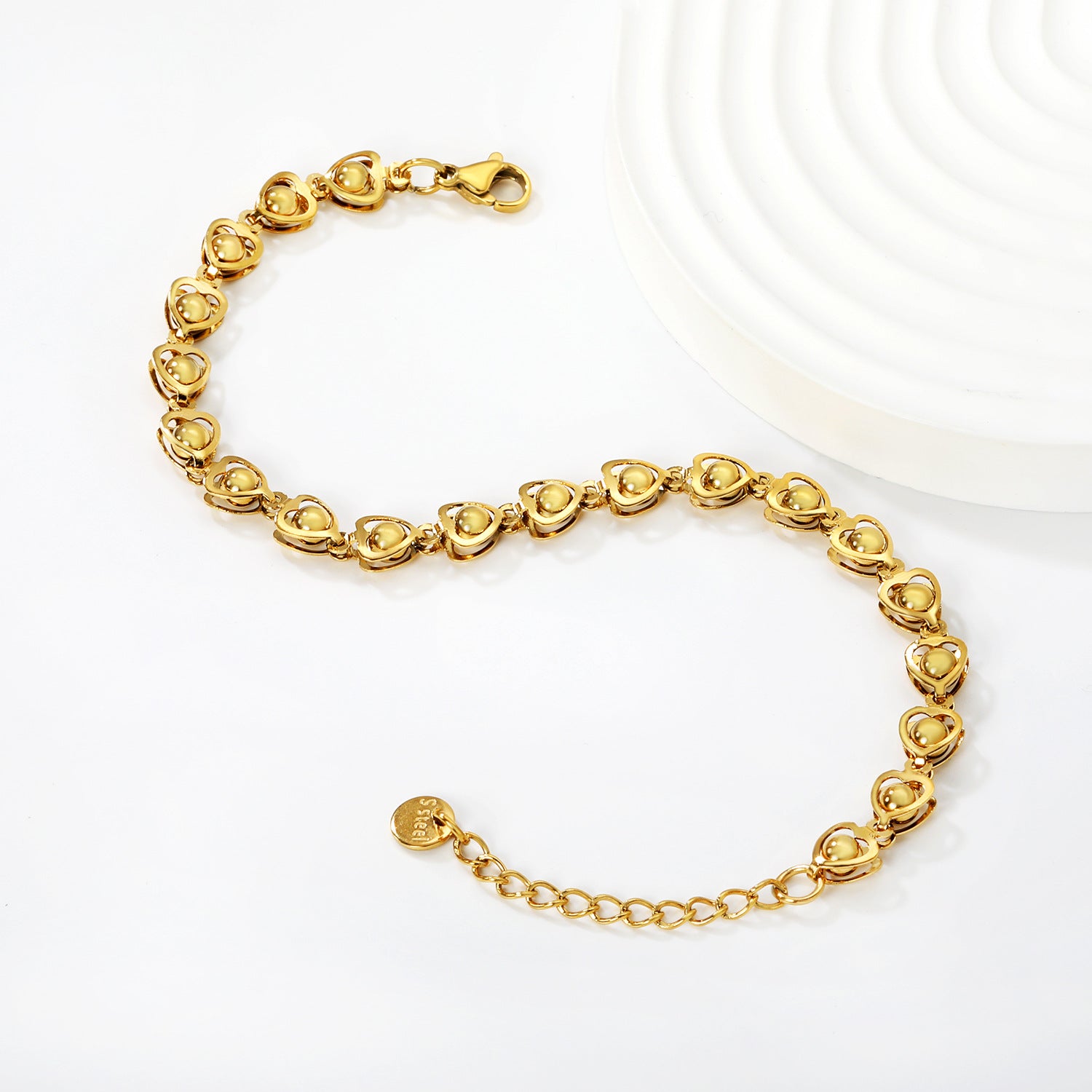 Damen Armband aus hochwertigem Edelstahl mit herzförmigen Anhängern Shop Nory