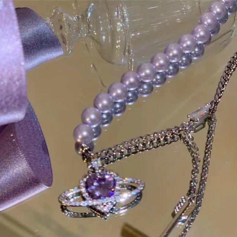 Damen Halskette mit verspieltem Anhänger und eleganten Perlendetails Shop Nory