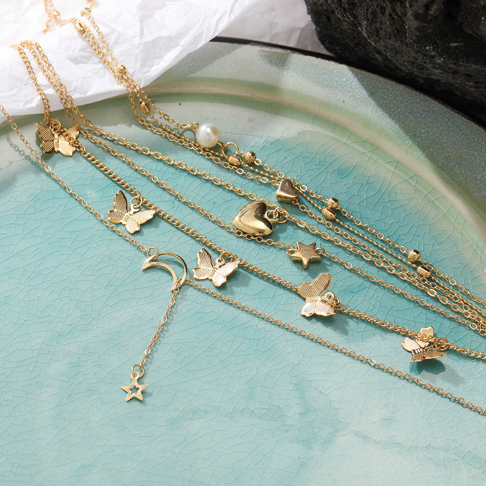 Damen Schmuckset mit mehrlagigen Ketten und vielfältigen Ringen Shop Nory