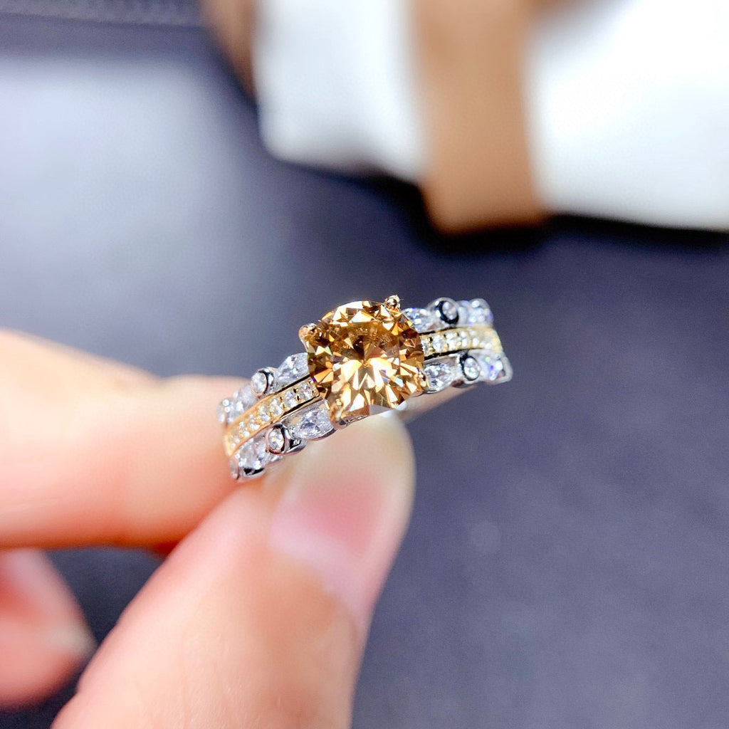 Damenring mit majestätischem, rundem Edelstein und glitzerndem Zirkonia-Besatz Shop Nory