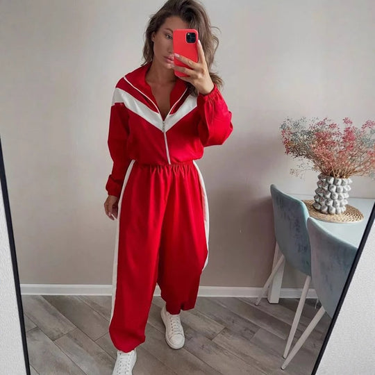 Damen tailliertes Zip-Trainingsset mit Chevron-Einsatz, Kordelzugsaum und hochgeschnittener Jogginghose Shop Nory