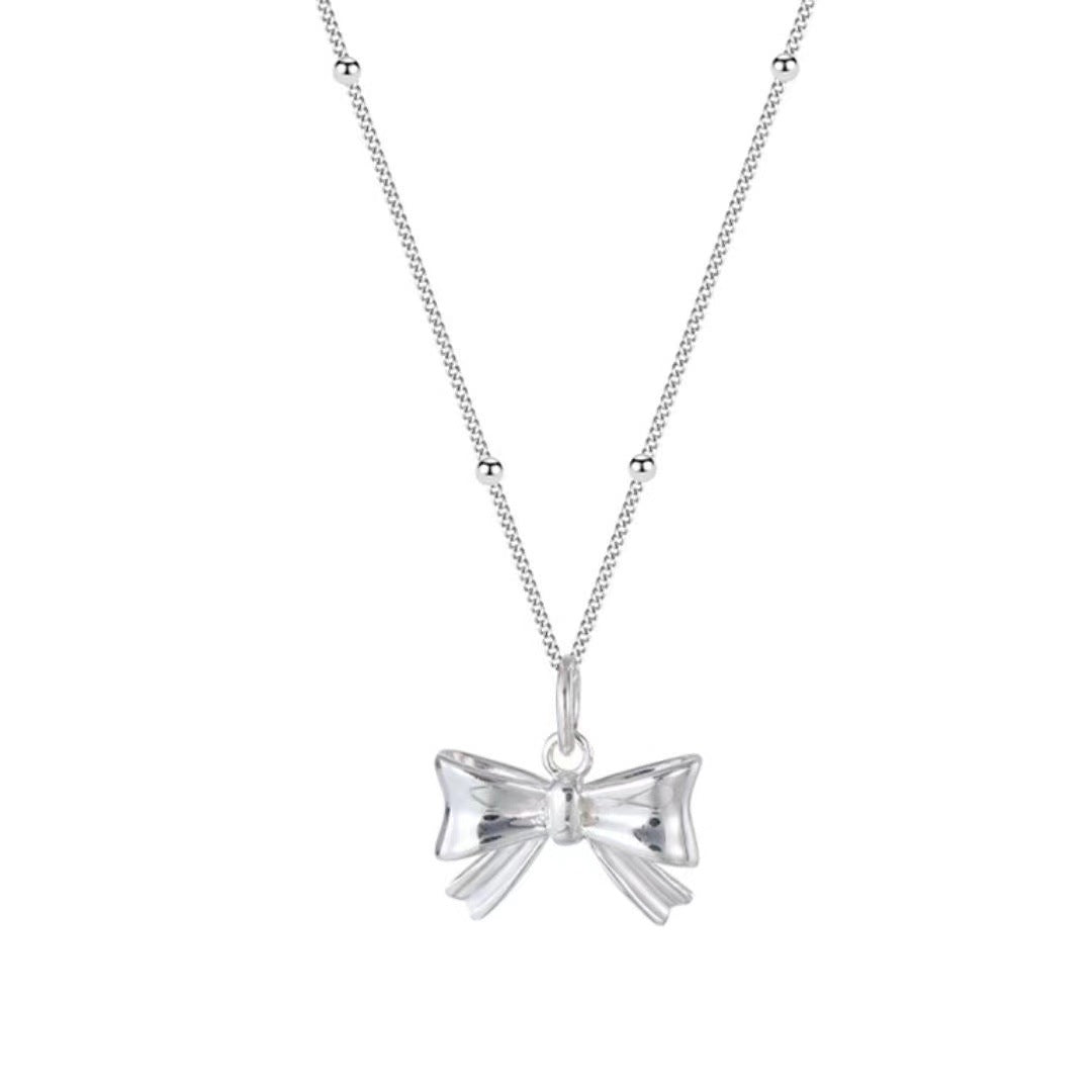 Damen Halskette mit filigranem Schleifenanhänger und hochwertiger Gliederkette Shop Nory