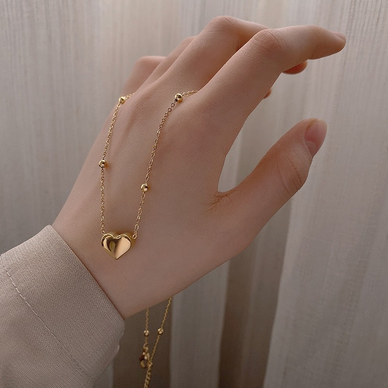 Damen Halskette mit herzförmigem Anhänger und zarten Details Shop Nory