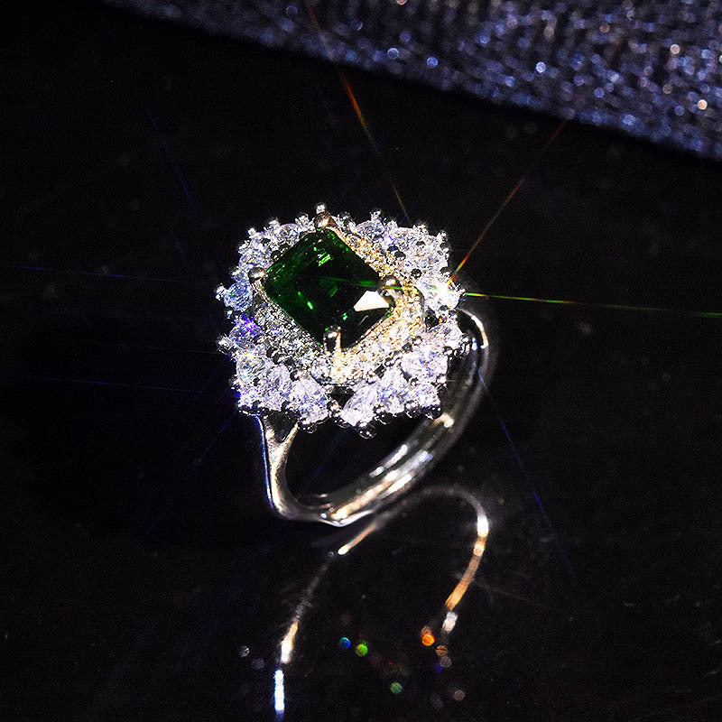 Damenring mit elegantem smaragdgrünem Edelstein und funkelnden Zirkonia-Steinen Shop Nory
