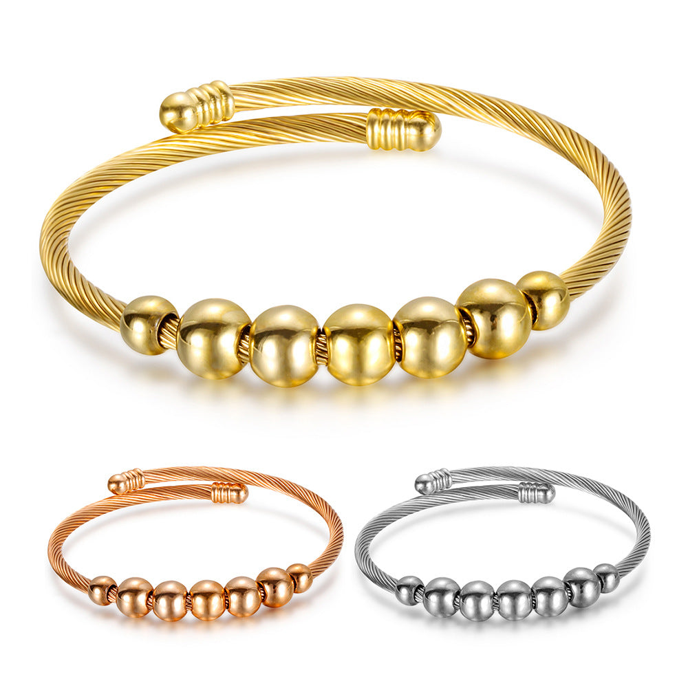 Damen Armreif mit elegantem, geschwungenem Drahtdesign und glänzenden Metallakzenten Shop Nory