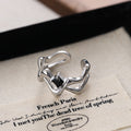 Damen Offener Ring mit künstlerisch geschwungenem Design und zentralem Stein Shop Nory