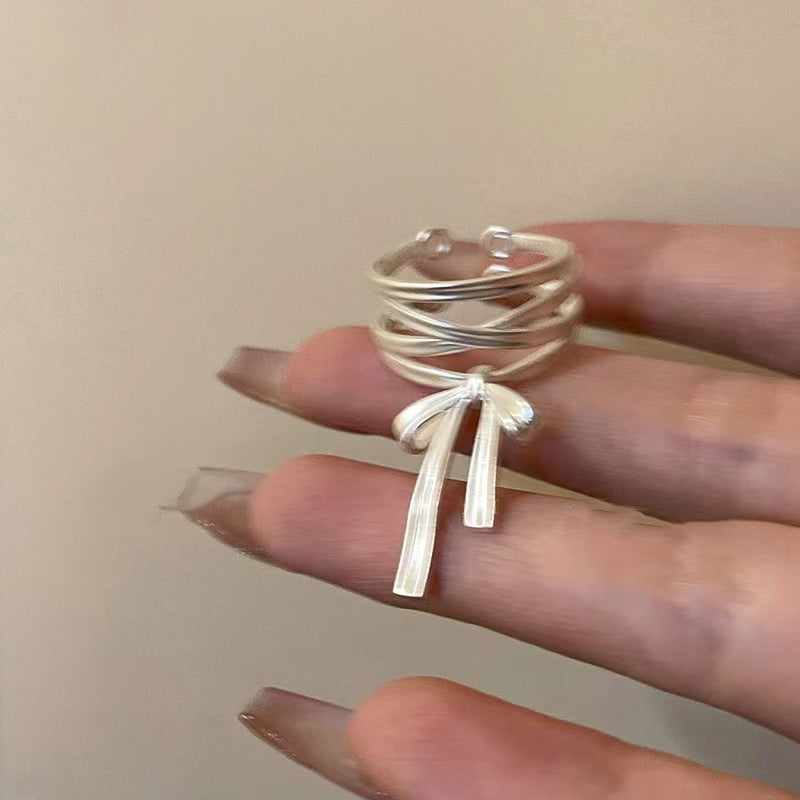 Damen Offener Ring mit kunstvollem Banddesign und elegantem Schleifenmotiv Shop Nory