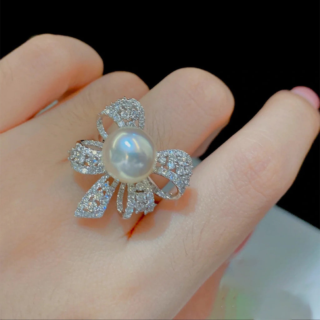Damenring mit elegantem Schleifenmotiv und strahlender Perle Shop Nory