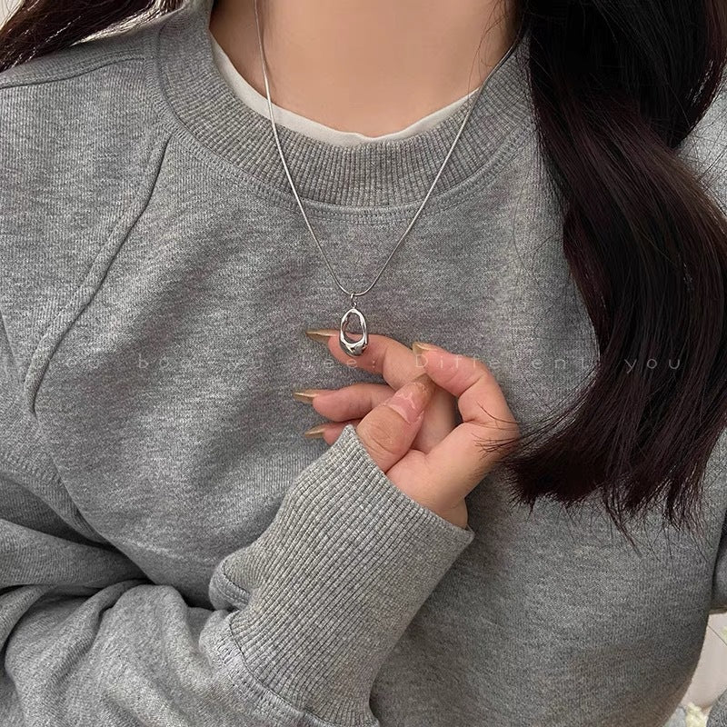 Damen Halskette mit modernem, geschwungenem Anhänger aus hochwertigem Edelstahl Shop Nory