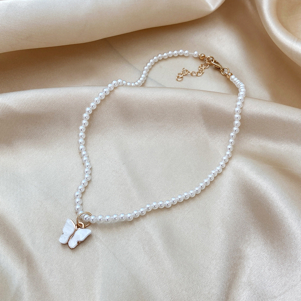 Damen Halskette mit elegantem Schmetterlingsanhänger aus Perlen Shop Nory