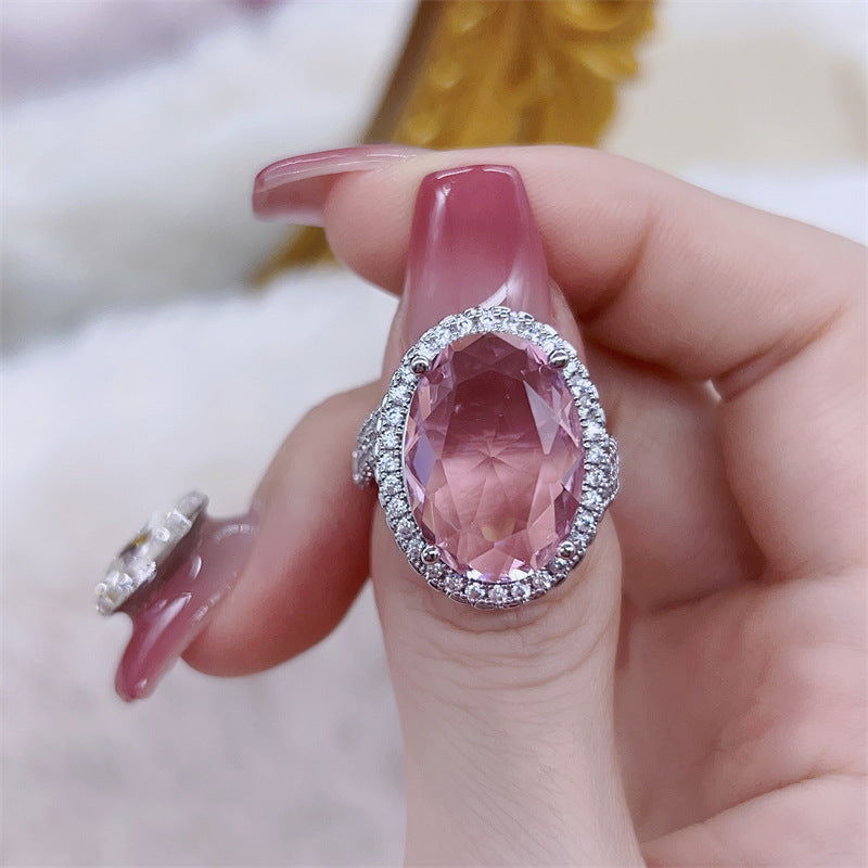 Damen eleganter Schmuckring mit ovalem Stein und funkelndem Zirkonia-Besatz Shop Nory