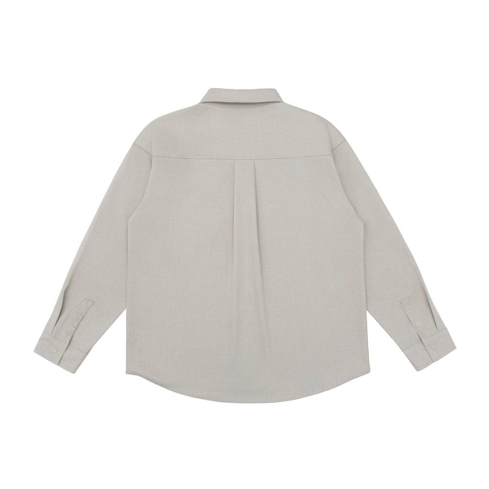 Unisex Oversize Hemdjacke im minimalistischen Workwear Stil mit gerundetem Saum und Brustpattentasche Shop Nory