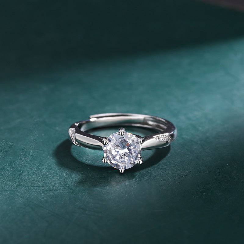 Damen verführerischer Ring mit funkelndem Zentrum und zarten Zirkonia-Details Shop Nory