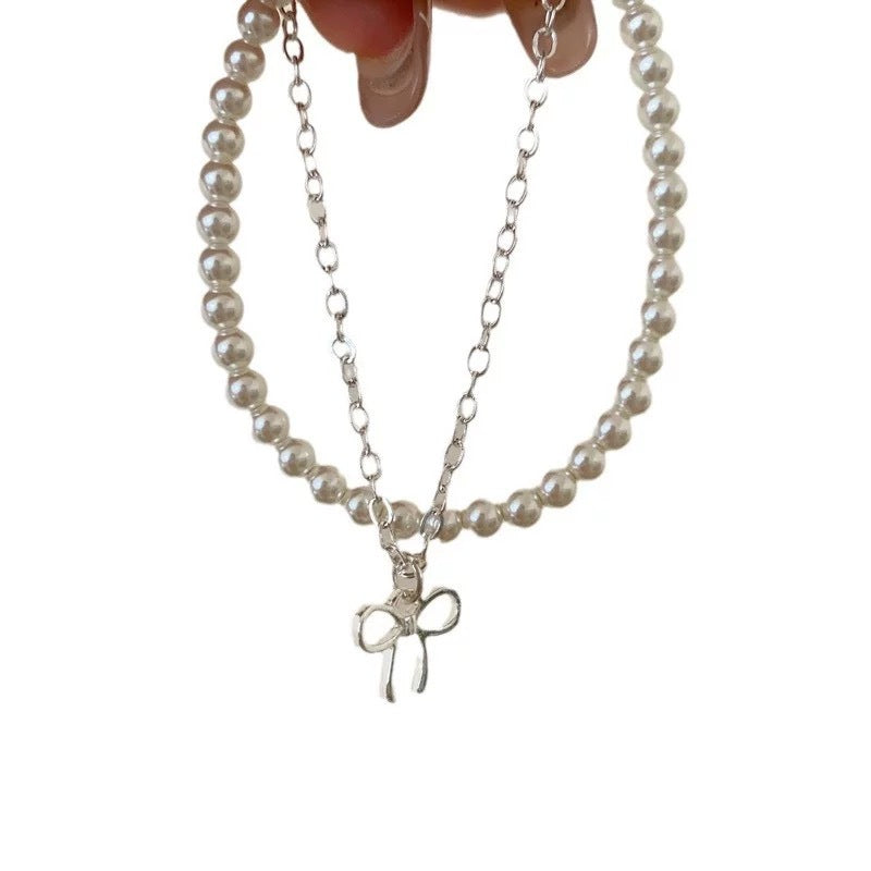 Damen Armbandset mit Perlen und charmantem Schleifenanhänger Shop Nory
