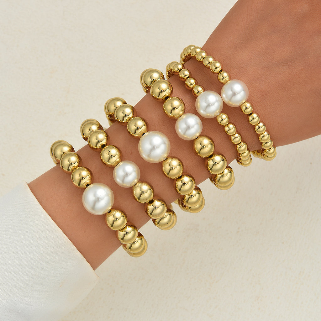 Damen Armband-Set mit glänzenden Perlen und goldenen Akzenten Shop Nory