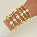 Damen Armband-Set mit glänzenden Perlen und goldenen Akzenten Shop Nory