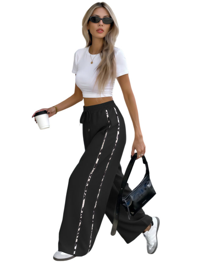 Damen Weite High‑Waist Loungehose mit Kordelzug und kontrastierenden Seitenstreifen Shop Nory