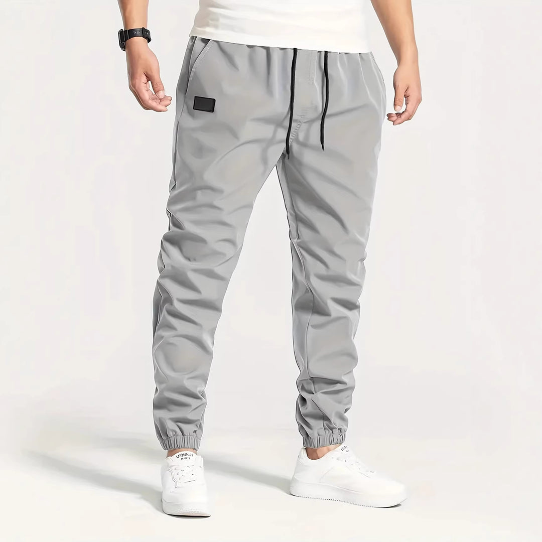 Herren Technische Jogginghose im Tapered‑Utility‑Stil mit elastischem Bund & Knöchelbündchen Shop Nory