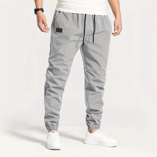 Herren Technische Jogginghose im Tapered‑Utility‑Stil mit elastischem Bund & Knöchelbündchen Shop Nory