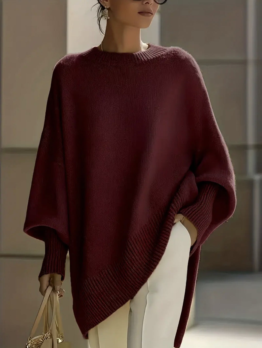 Damen nan Oversize Strickponcho mit asymmetrischem Saum und gerippten Ärmeln Shop Nory