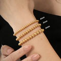Damen elegantes goldenes Perlenarmband Set Shop Nory