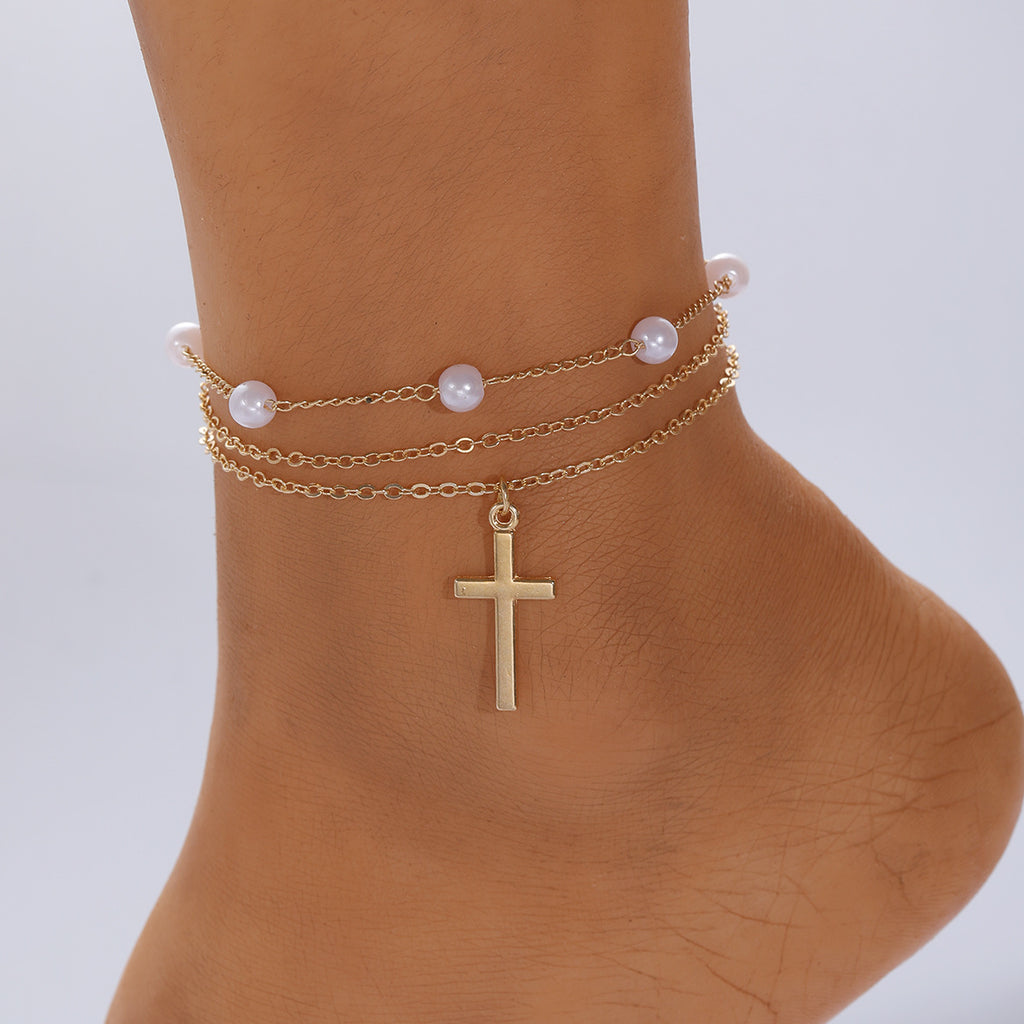 Damen Fußkettchen mit elegantem Perlendesign und subtilen Kreuzanhänger Shop Nory